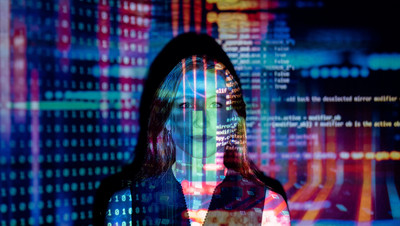 Woman with data reflection on her face