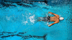 A man swims.  