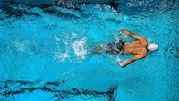 A man swims.  