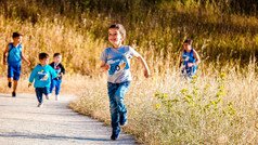 Children running in the countryside.