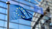 The European flag against a blurred background.
