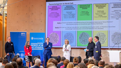 Five people on one stage. 